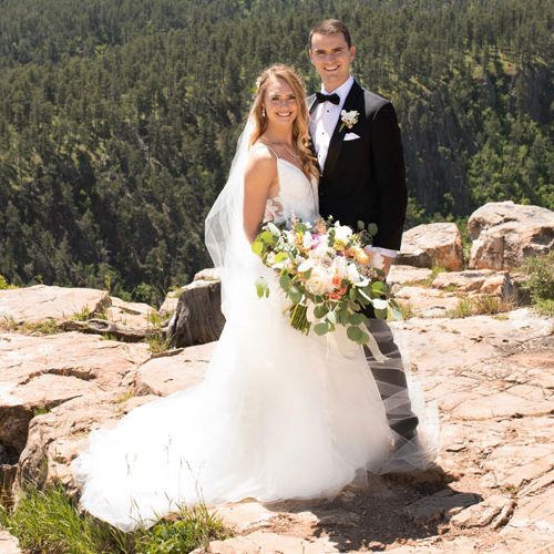 outdoor bride and groom with wedding bouquet