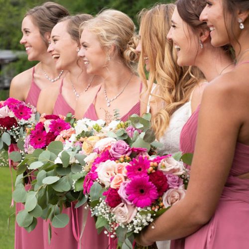bridal party holding wedding flowers