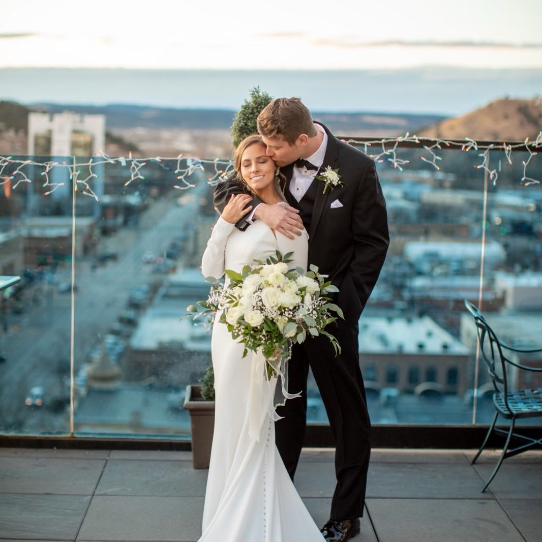 Bride and Groom at the Apex with bouquet