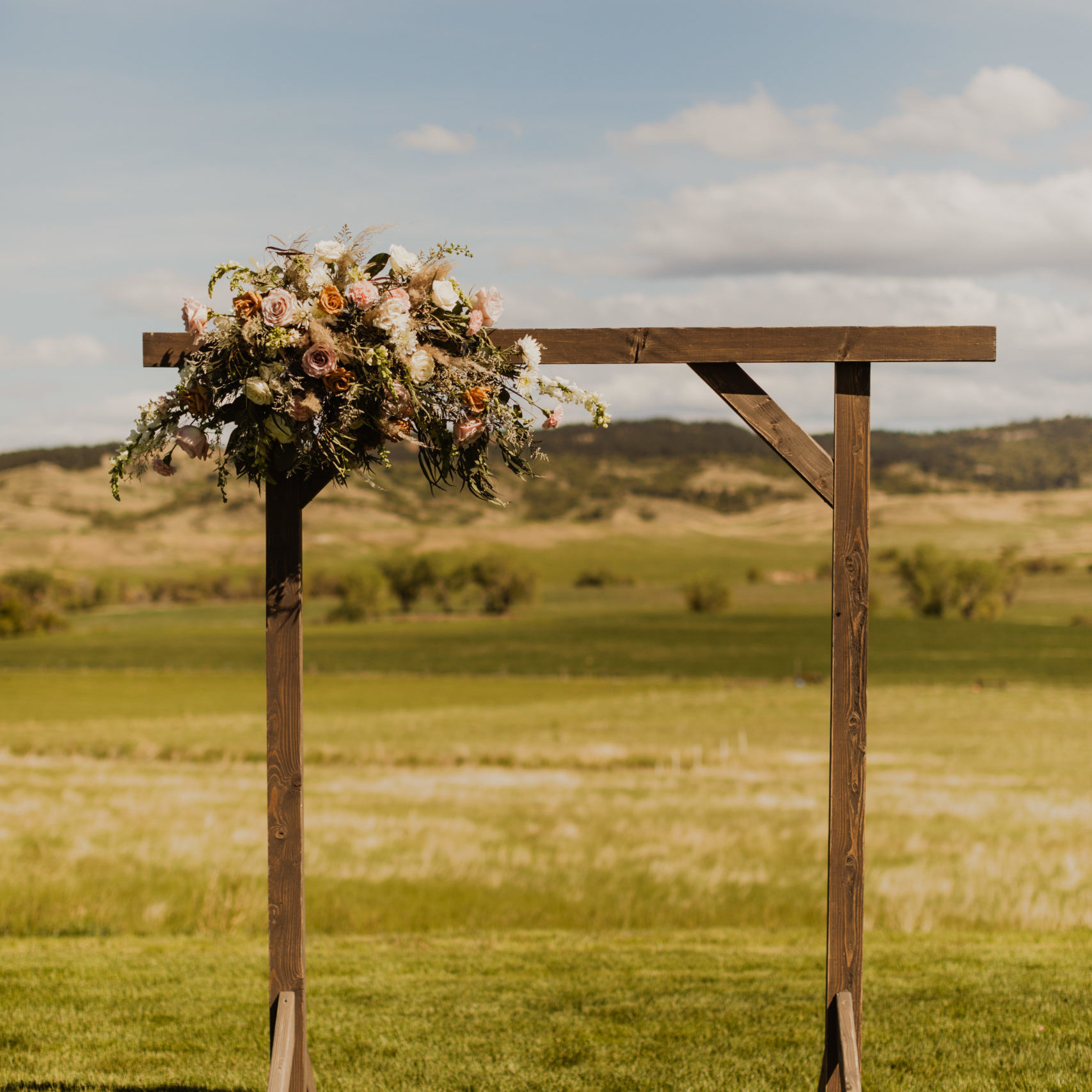 Wooden square frame with wedding flower bouquet