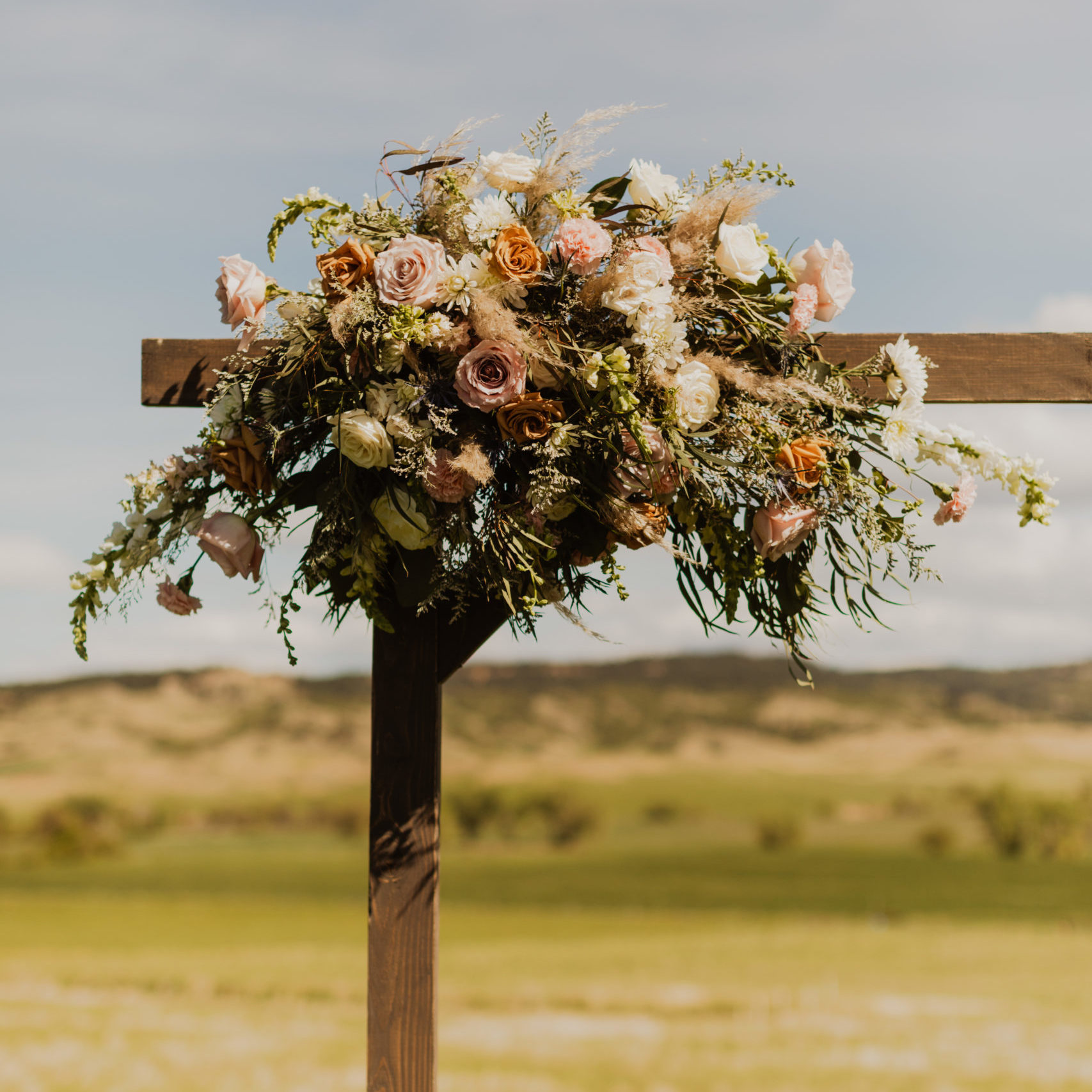 Wooden square frame with wedding flower bouquet