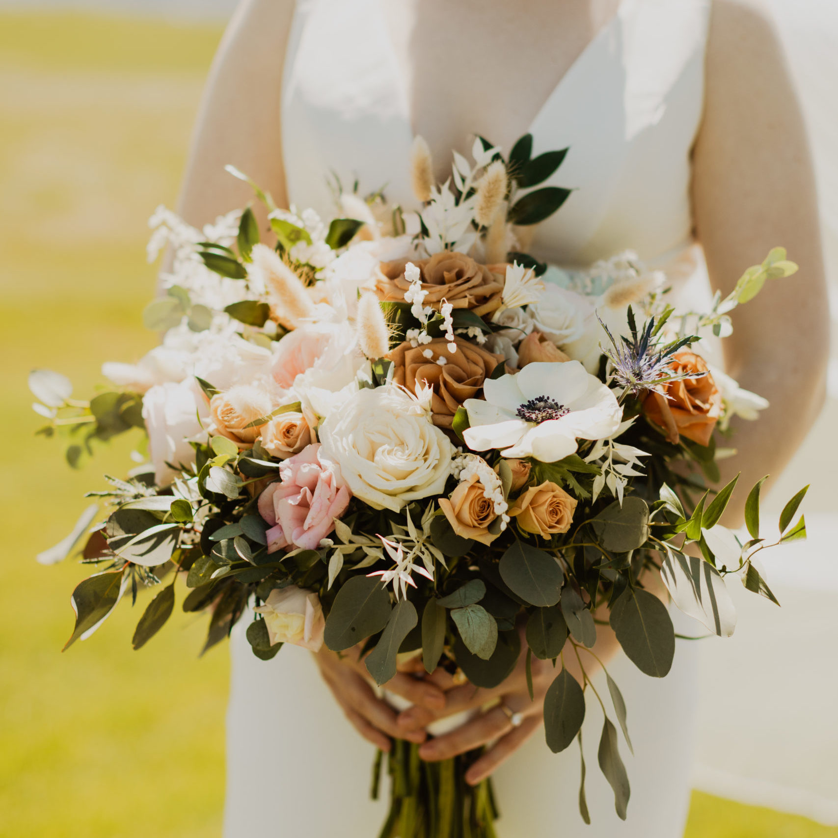 Katie holding her wedding flower bouquet